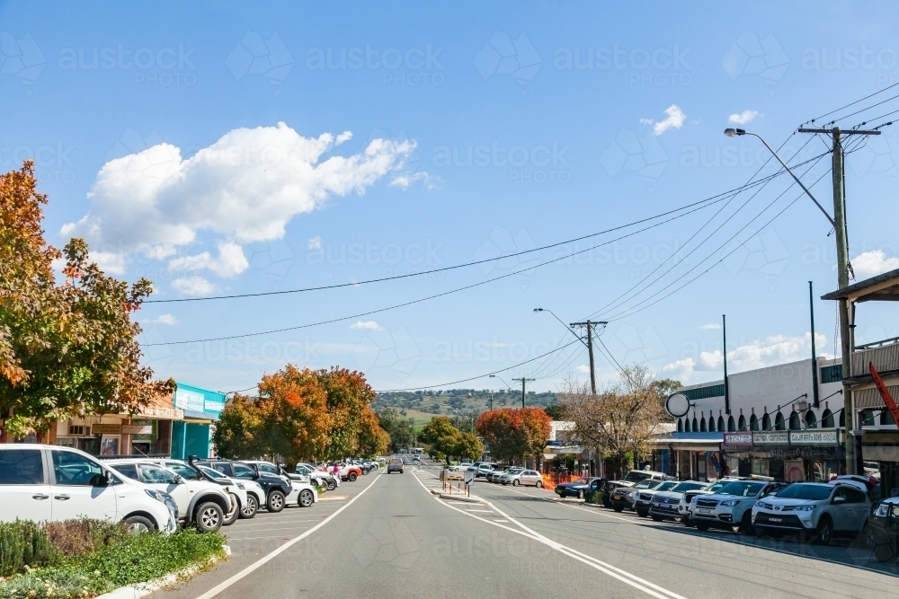 Main street in NSW country town of Merriwa on bright sunlit Autumn day - Australian Stock Image