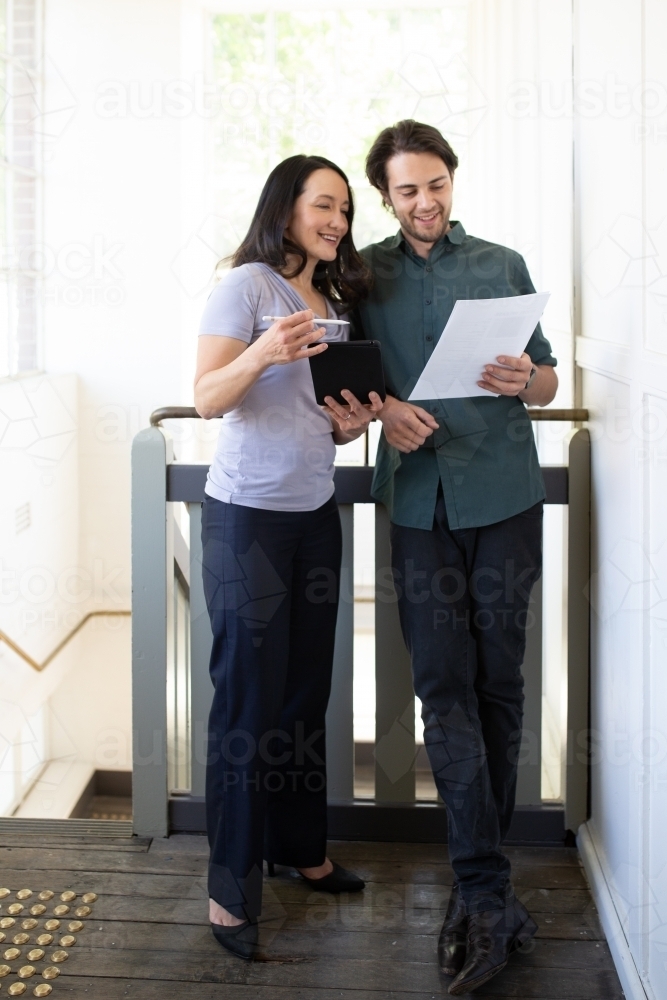 Man and woman standing talking - Australian Stock Image