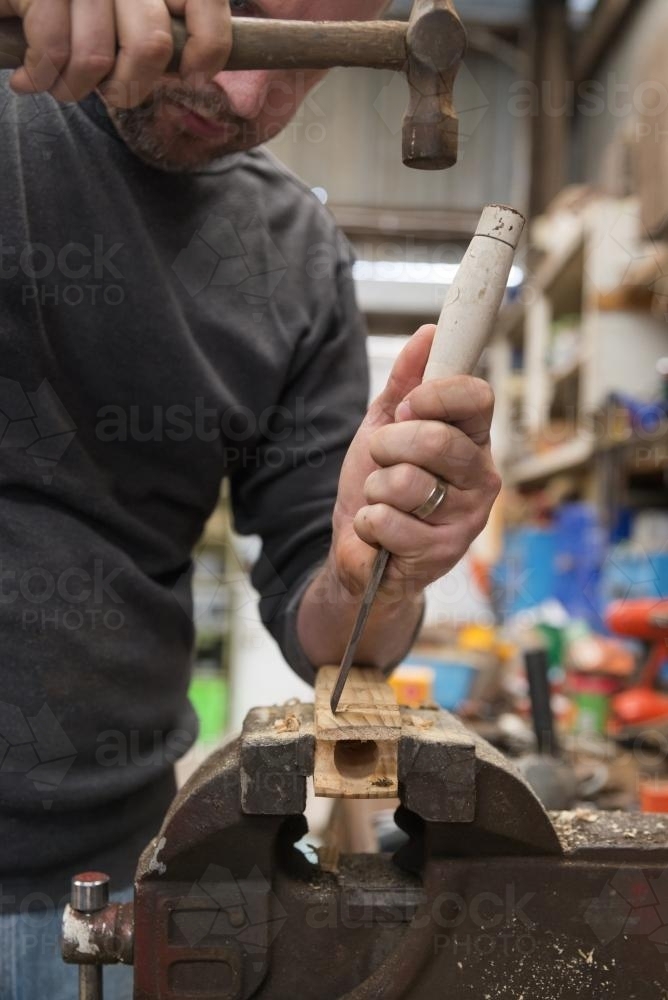 Man learning woodwork in the shed - Australian Stock Image