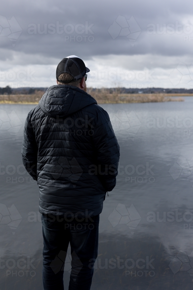 Man Looking Across Lake - Australian Stock Image