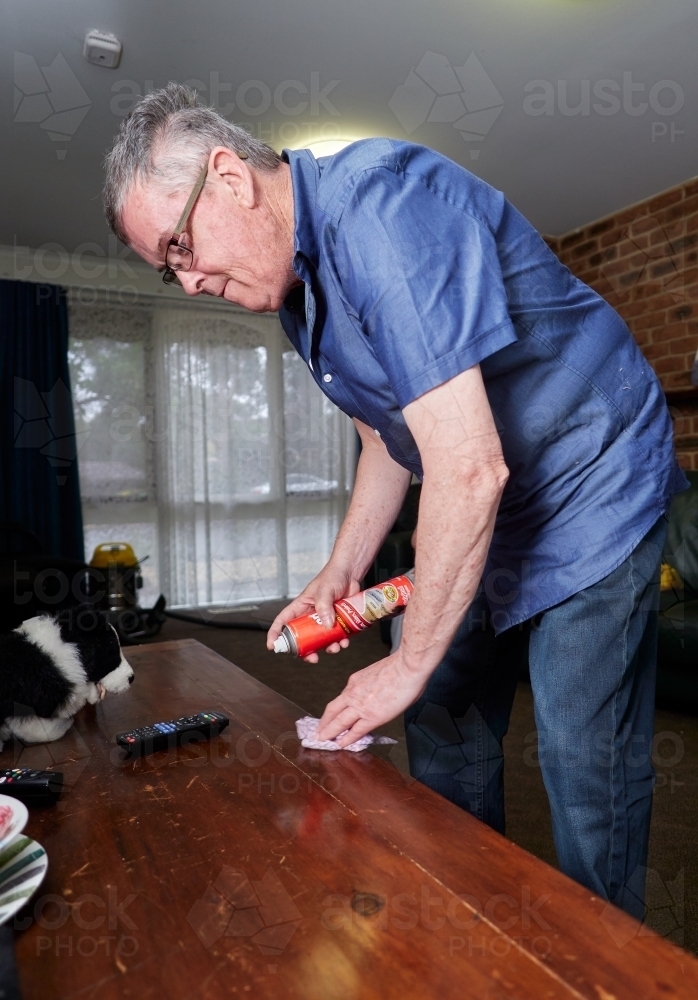 Man Polishing Furniture - Australian Stock Image