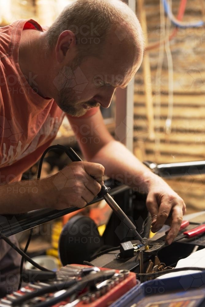 Man working on car - Australian Stock Image