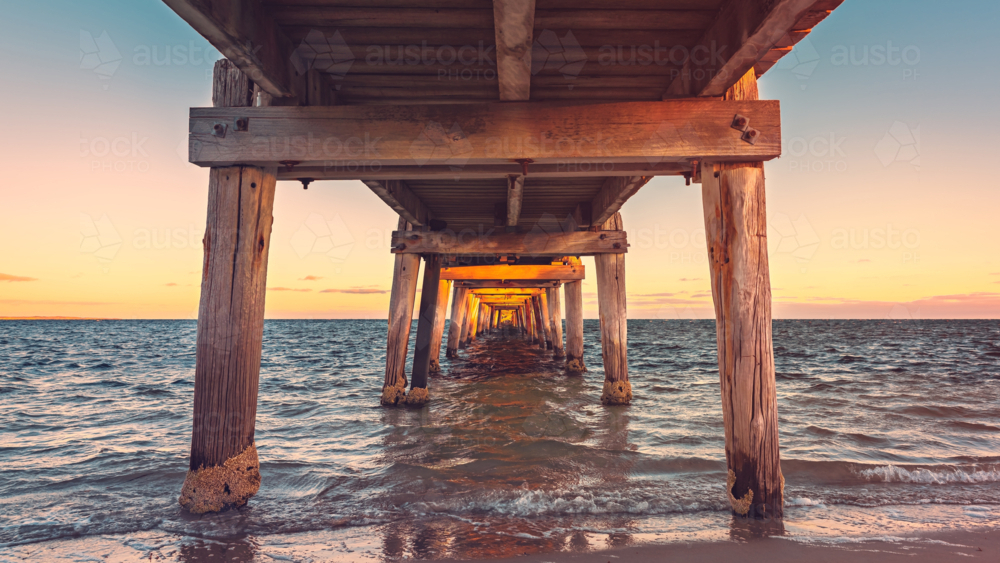 Marion Bay jetty viewed from underneath at sunset, Yorke Peninsula, South Australia - Australian Stock Image