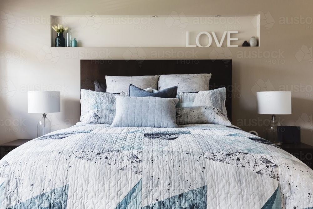 Master bedroom with contemporary quilt duvet and pillows - Australian Stock Image