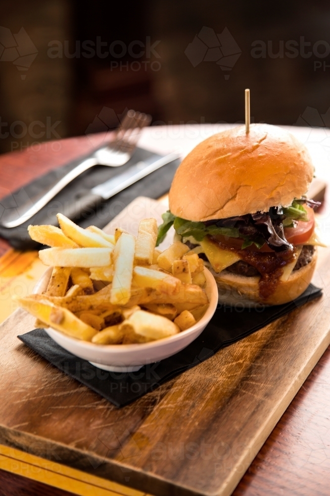 Meal of burger and fries in a cafe - Australian Stock Image