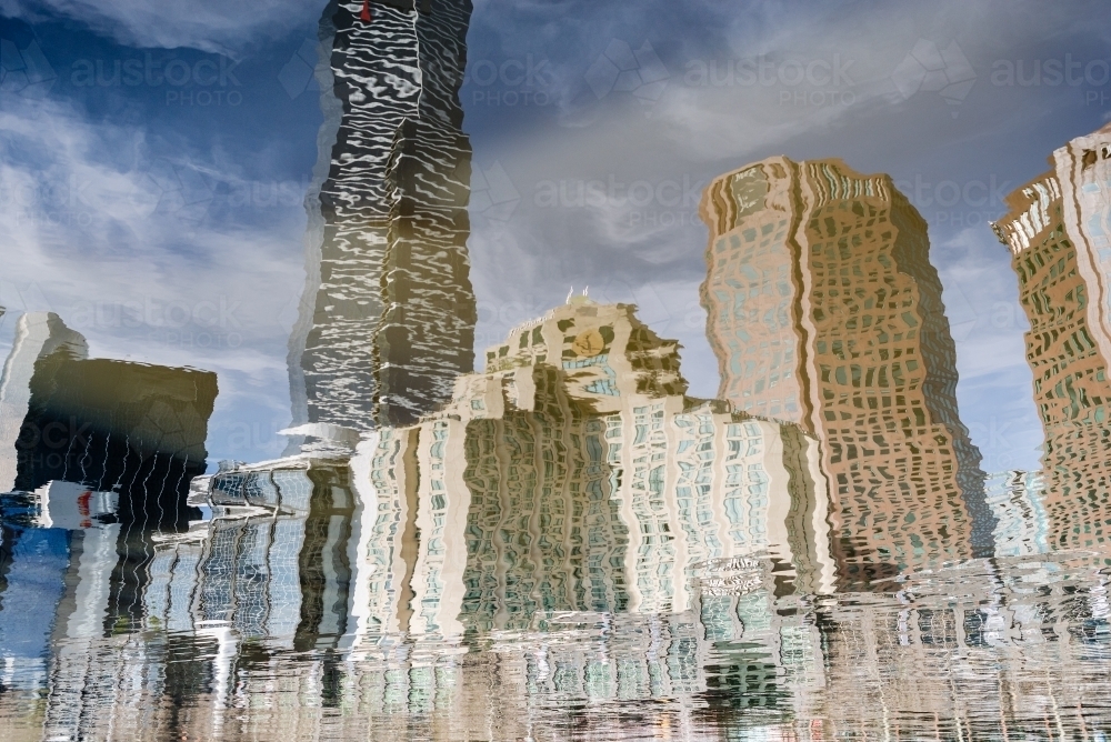 Melbourne City skyline reflection in the Yarra River creating a watercolour painting effect - Australian Stock Image