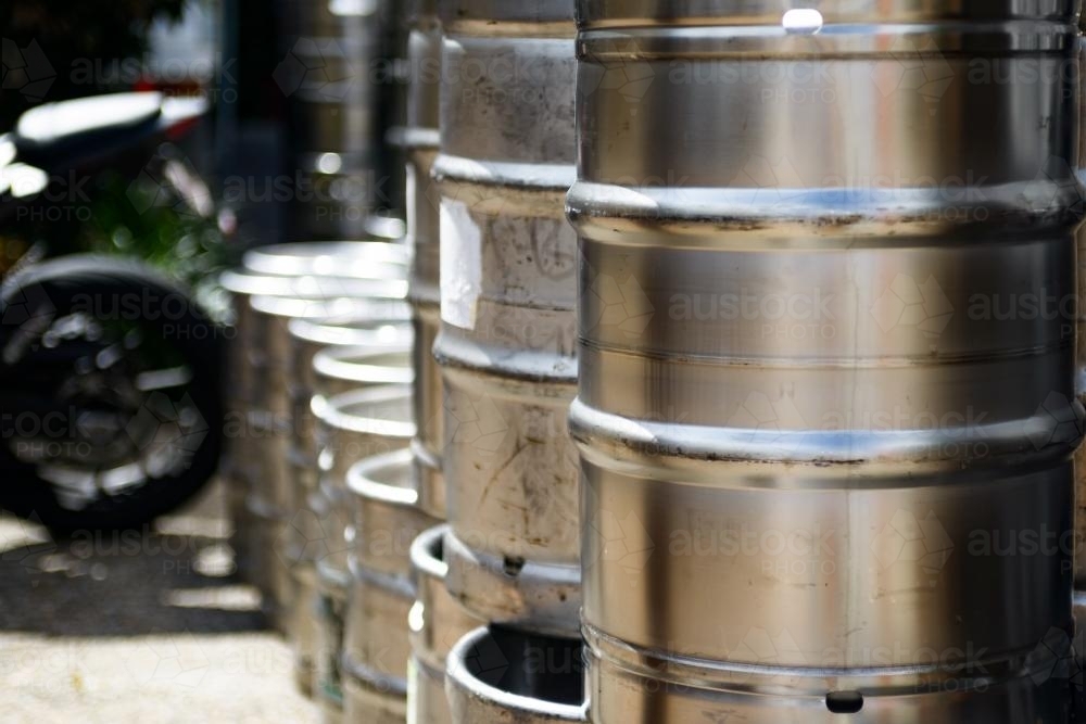 Metal beer kegs stacked in rows - Australian Stock Image