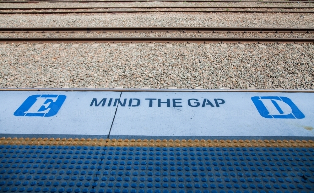 Mind the gap sign on train station platform - Australian Stock Image