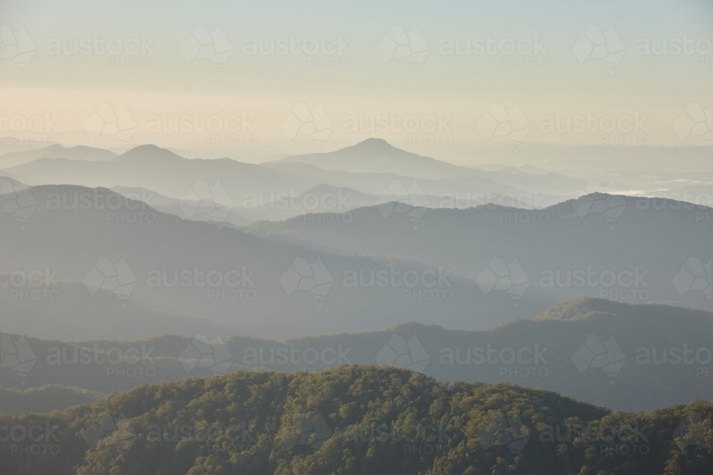 Misty mountain range during sunset - Australian Stock Image
