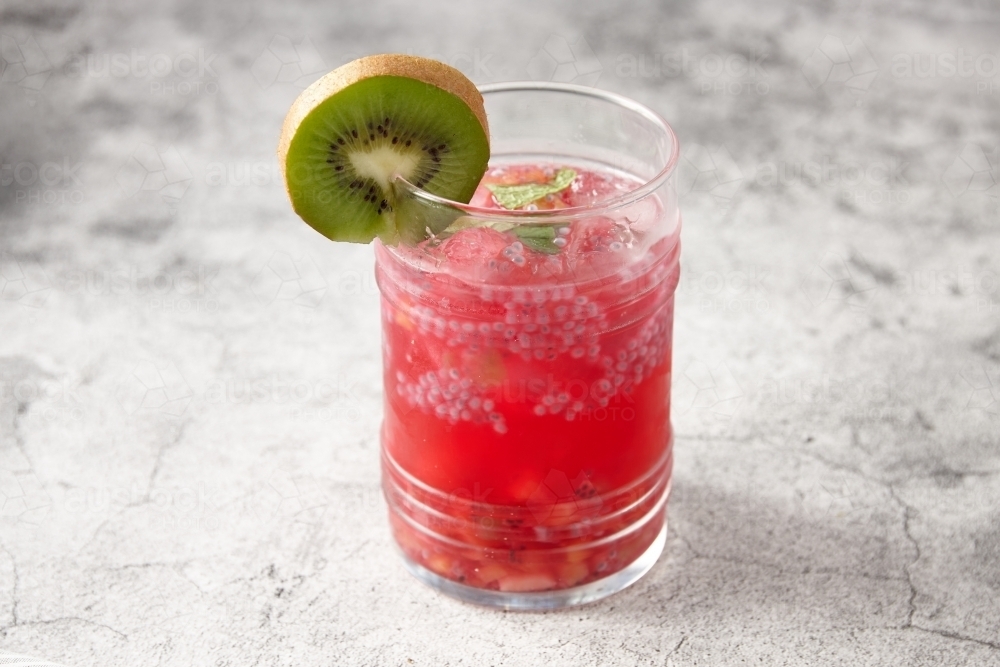 Mixed fruit saruwath drink with kiwi garnish - Australian Stock Image