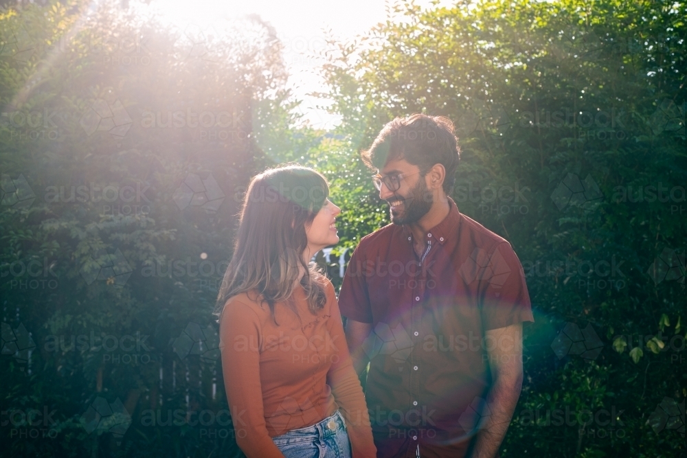 mixed race couple outdoors - Australian Stock Image