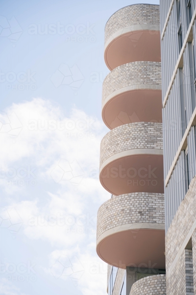 Modern building with multiple levels of balconies - Australian Stock Image