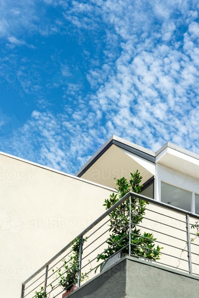 modern generic white apartment building against blue sky - Australian Stock Image