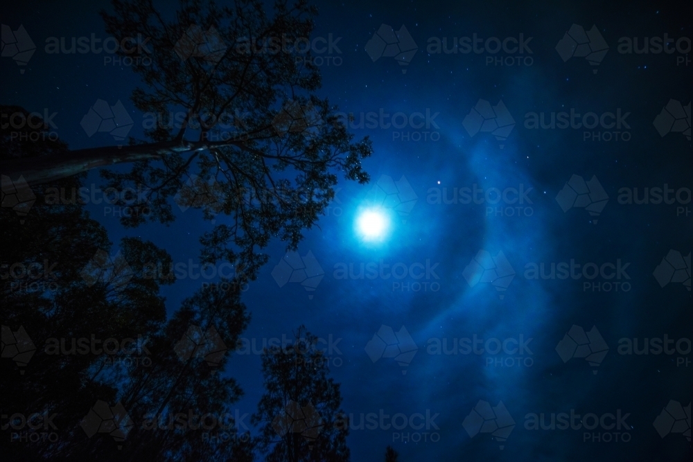 Moon halo in the night sky above. - Australian Stock Image