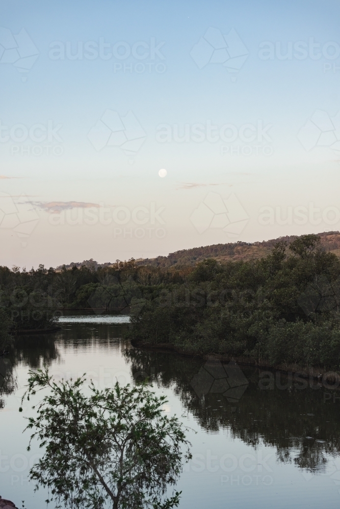 Moon rising over Lake Macquarie, NSW - Australian Stock Image