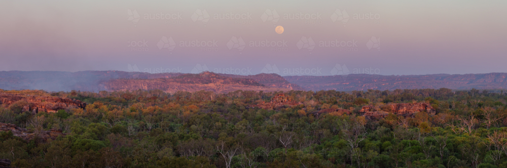 Moonrise over Kakadu, Arnhem Land in soft dusk light - Australian Stock Image