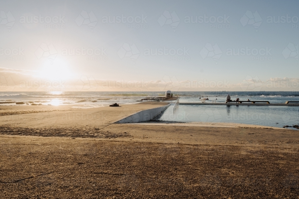 Morning sunrise swim at Merewether Ocean Baths, Newcastle, NSW - Australian Stock Image