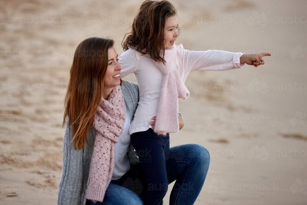 Mother and daughter at beach on sunset - Australian Stock Image