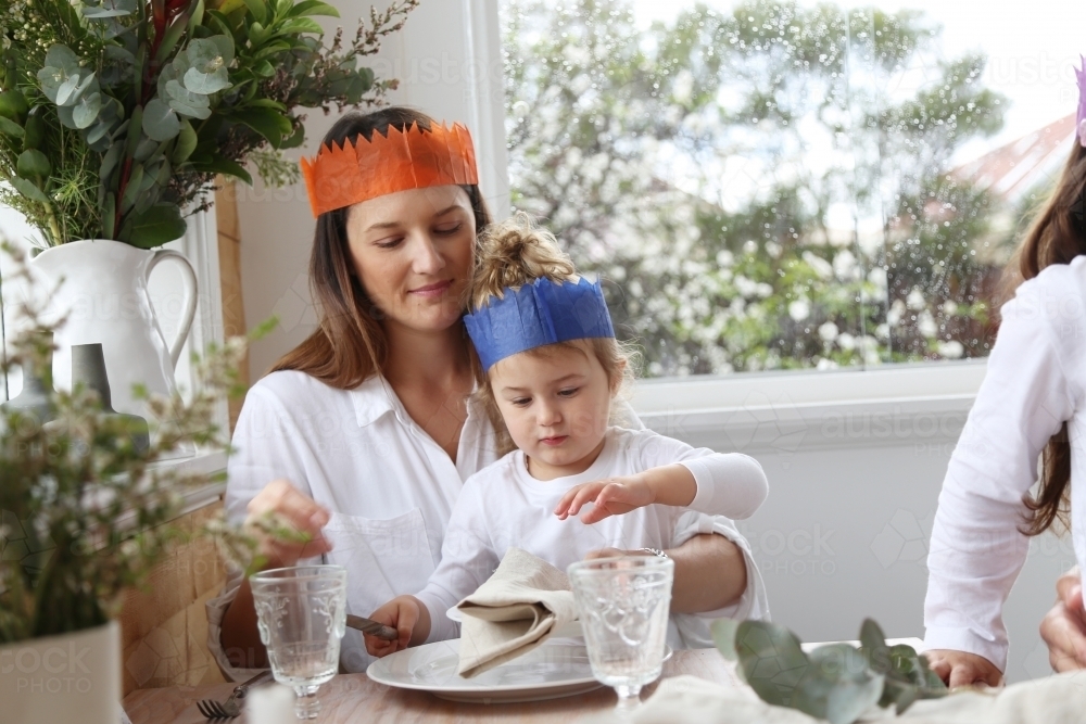 Mother and daughter at Christmas table - Australian Stock Image