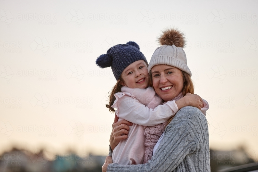 Mother and daughter sharing special moments together in winter - Australian Stock Image