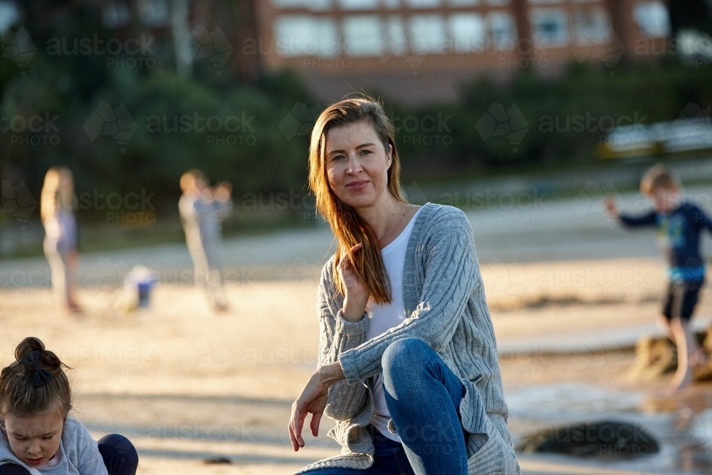 Mother and daughter sharing time at beach together - Australian Stock Image