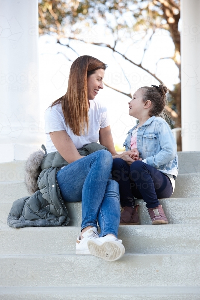 Mother and daughter sharing time together outdoors - Australian Stock Image