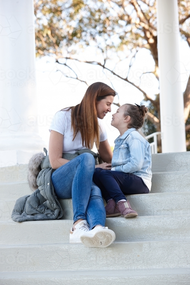 Mother and daughter sharing time together outdoors - Australian Stock Image