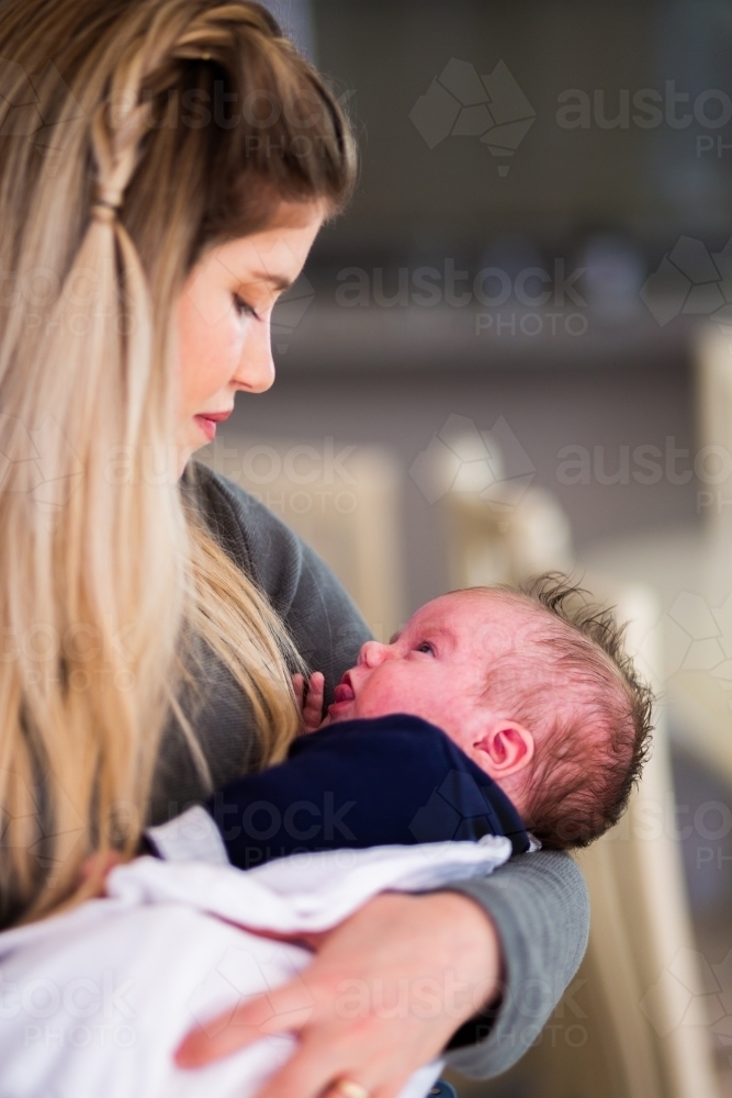 Mother holding newborn baby - Australian Stock Image