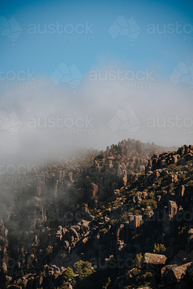 Mountains rugged rock terrain over the coast - Australian Stock Image
