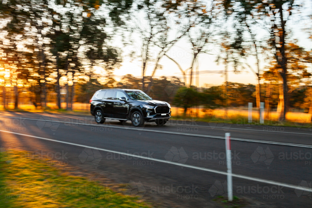 Movement of car travelling past in rural country setting in Australia - Australian Stock Image