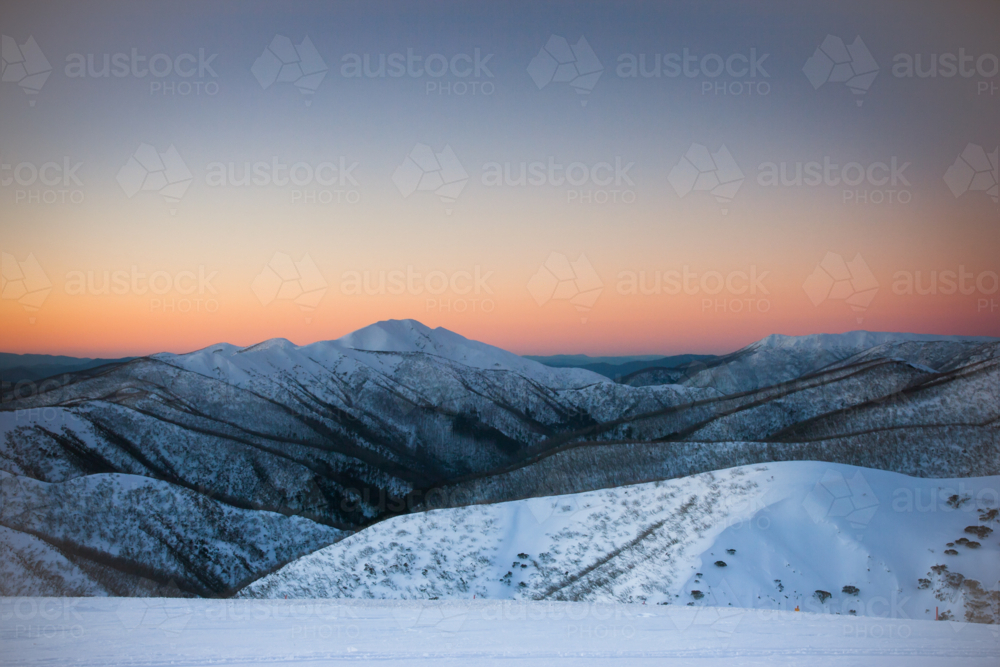 Mt Feathertop and surrounding landscape at sunset during winter near Mt Hotham in Victoria - Australian Stock Image