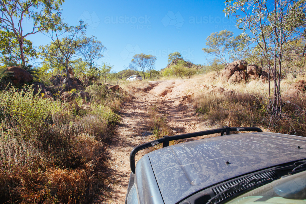 Mt Surprise, Australia - July 6, 2016: A 4WD car negotiating a rural track in the outback - Australian Stock Image
