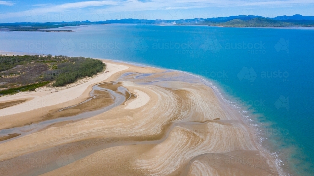 multicolour patterns at low tide on sands flats at The Point near Bird Island, Queensland - Australian Stock Image