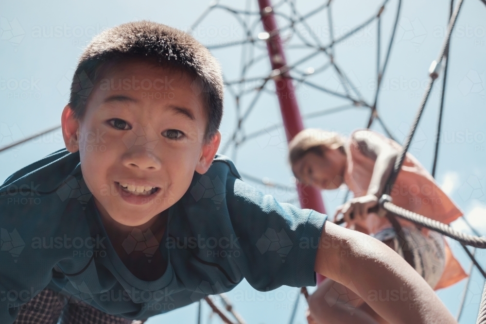 multicultural kids having fun at playground - Australian Stock Image