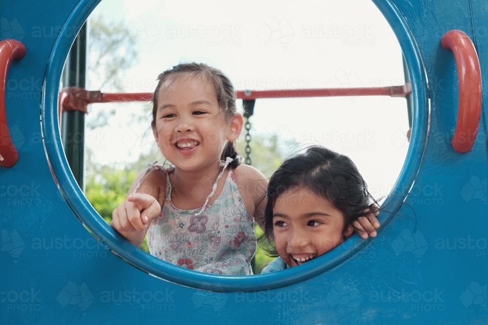 multicultural kids having fun at playground - Australian Stock Image