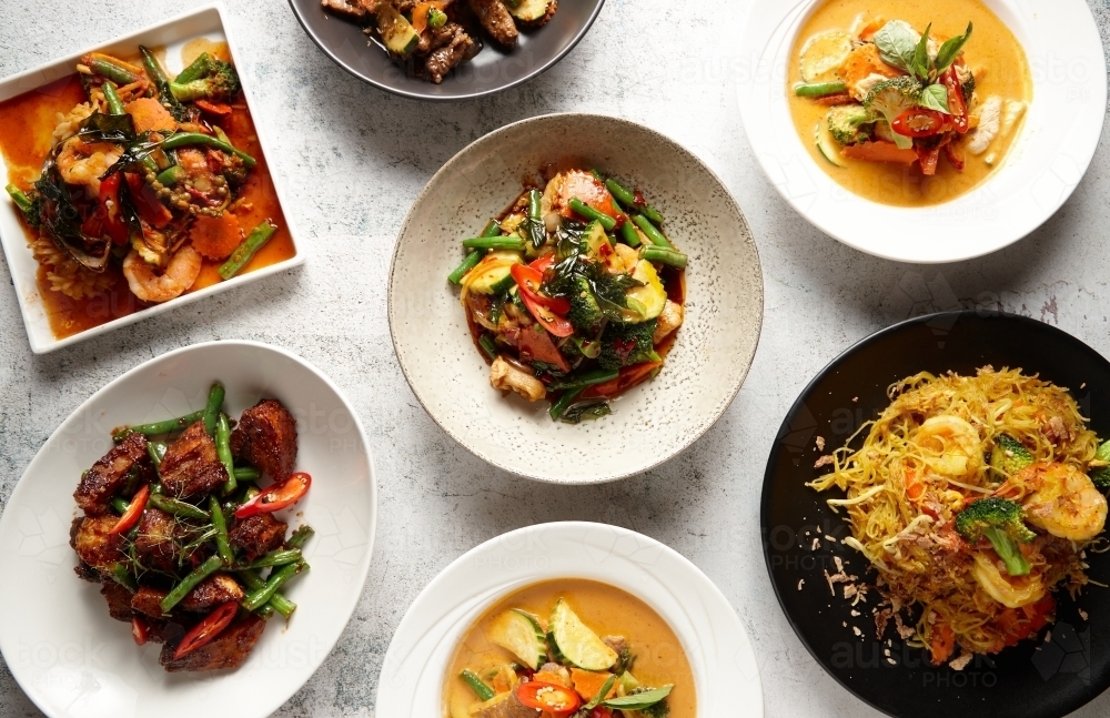 Multiple bowls of different thai food - Australian Stock Image