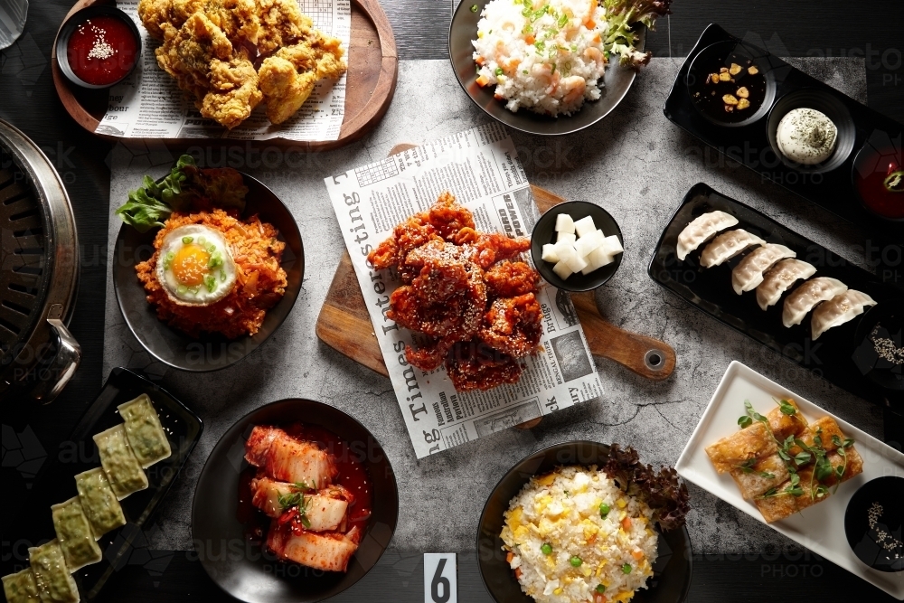 multiple korean dishes on table - Australian Stock Image