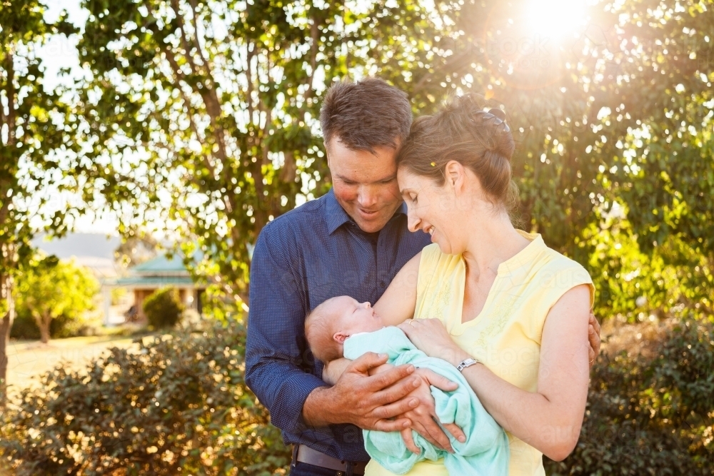 Mum and dad with their newborn daughter - Australian Stock Image