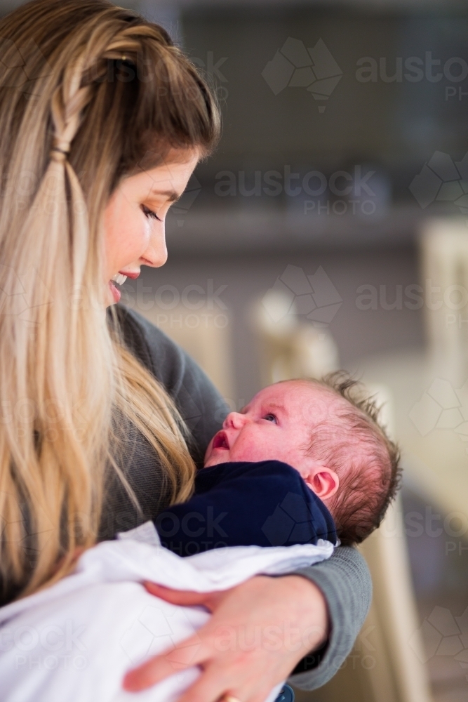 Mum smiling at baby boy - Australian Stock Image