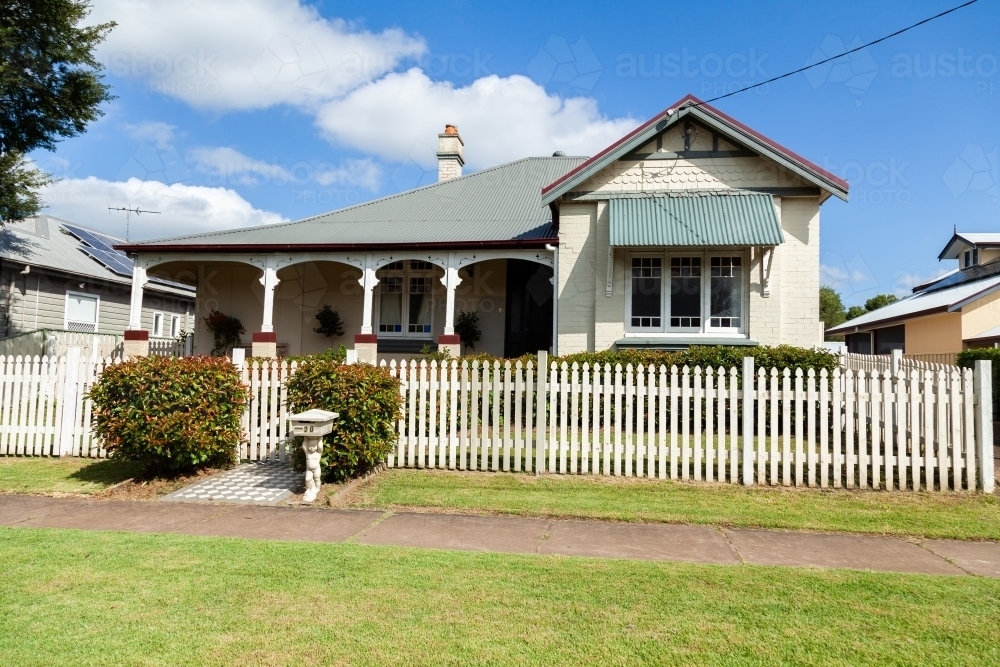 Neat little house with front verandah and picket fence in Maitland, New South Wales - Australian Stock Image