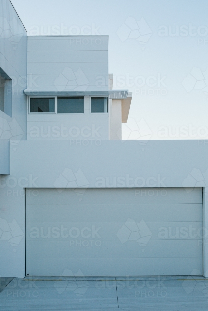 New suburban, clean, modern architecture white exterior, evening light - Australian Stock Image