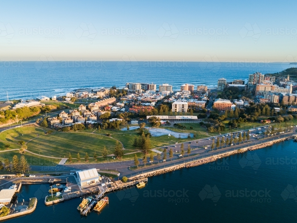 Newcastle foreshore with park and city behind seen from aerial view - Australian Stock Image