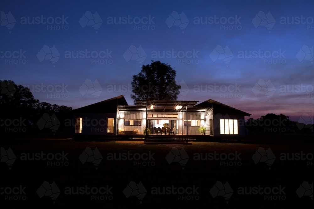 Nighttime shot of a modern architecture home. - Australian Stock Image