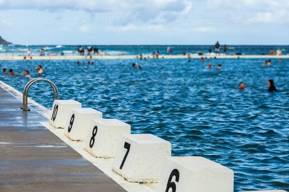 Numbered lane marker at ocean pool - Australian Stock Image