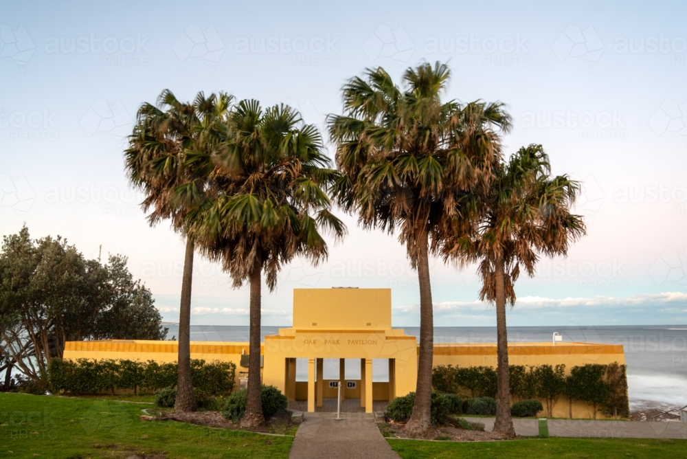 Oak Park Pavillion in Cronulla with palm trees at sunset - Australian Stock Image