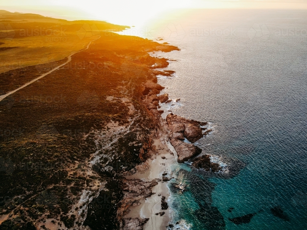 Ocean and cliffs from above with Golden Sunshine - Australian Stock Image