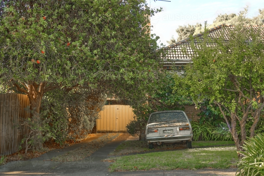 Old derelict care in suburban yard - Australian Stock Image