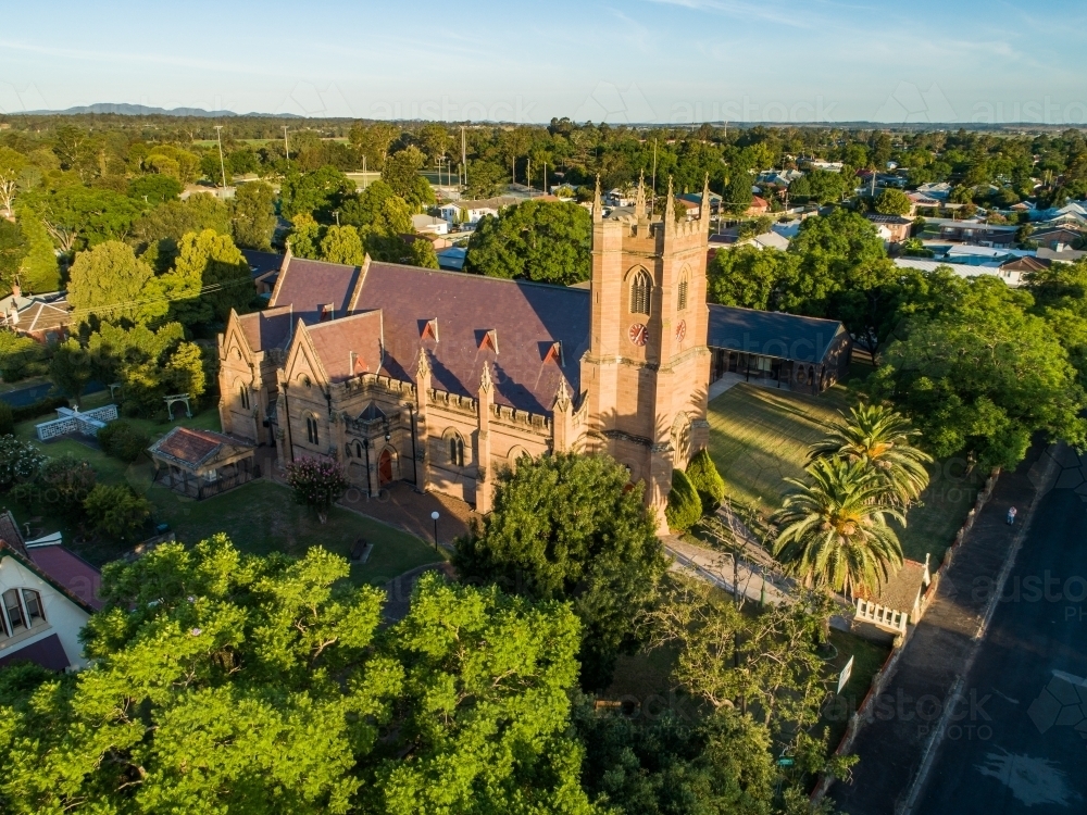 Old historic building Anglican church of Australia in Singleton seen from aerial view in Summer - Australian Stock Image