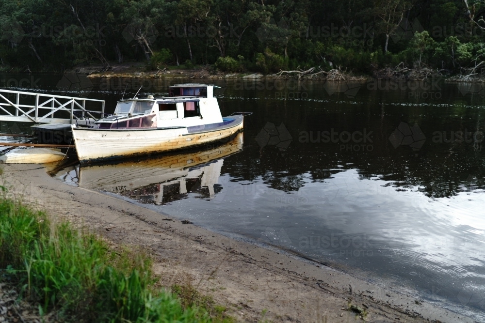 Old Ramshackle Boat Moored in a River - Australian Stock Image