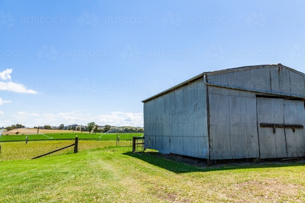 Image of Old shed on sunlit farm - Austockphoto